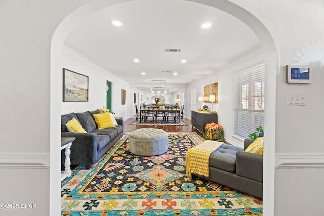 3368 Bevia Rd, Marianna, FL 32446 - living area featuring arched walkways, crown molding, recessed lighting, and wood finished floors