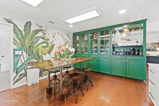 3368 Bevia Rd, Marianna, FL 32446 - bar featuring ornamental molding and wood finished floors