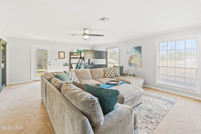 living room featuring light carpet, visible vents, and crown molding