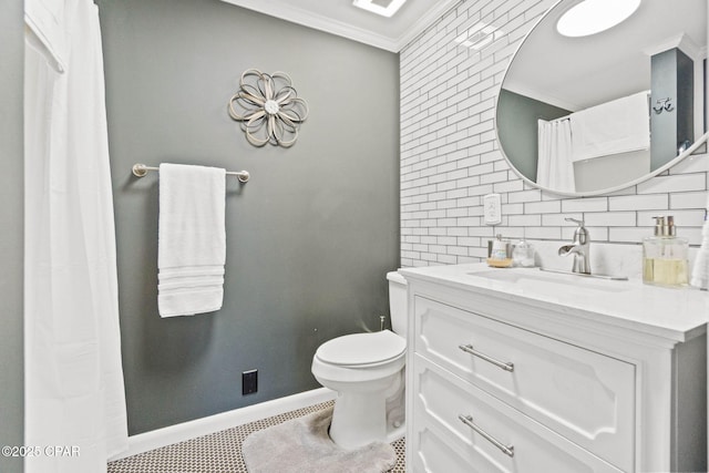 3368 Bevia Rd, Marianna, FL 32446 - full bathroom with crown molding, vanity, toilet, decorative backsplash, and baseboards