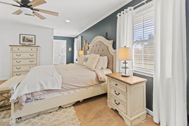 bedroom featuring light carpet, ornamental molding, multiple windows, and visible vents