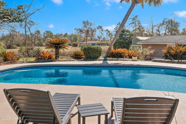 view of pool with fence and a fenced in pool