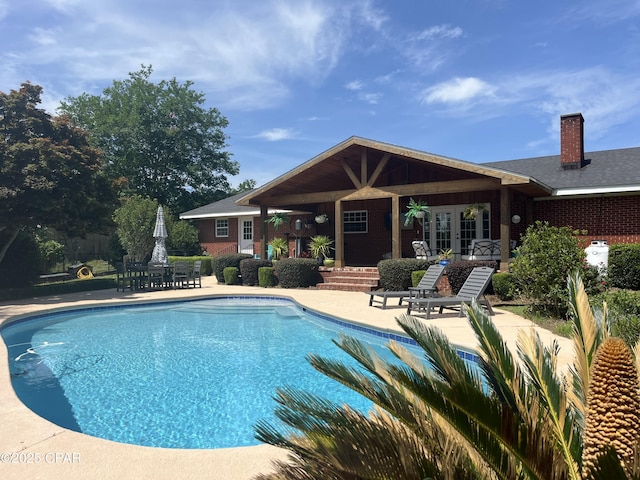3368 Bevia Rd, Marianna, FL 32446 - outdoor pool featuring french doors and a patio area