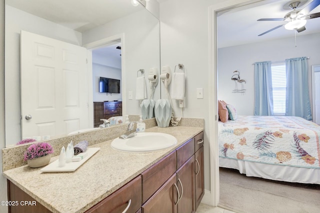 ensuite bathroom with vanity, ensuite bathroom, and a ceiling fan