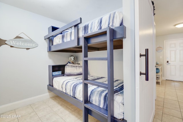 tiled bedroom with baseboards