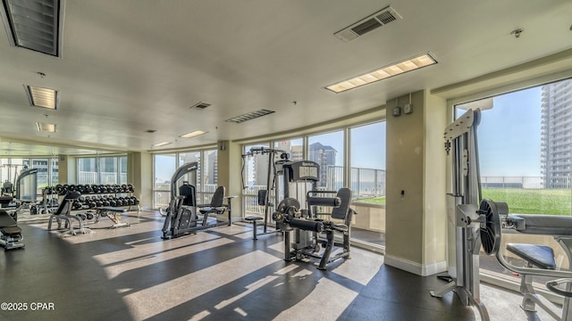 workout area with a view of city and visible vents