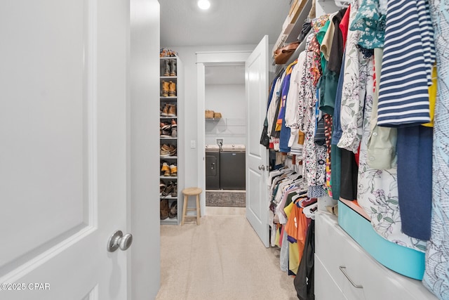 walk in closet with independent washer and dryer