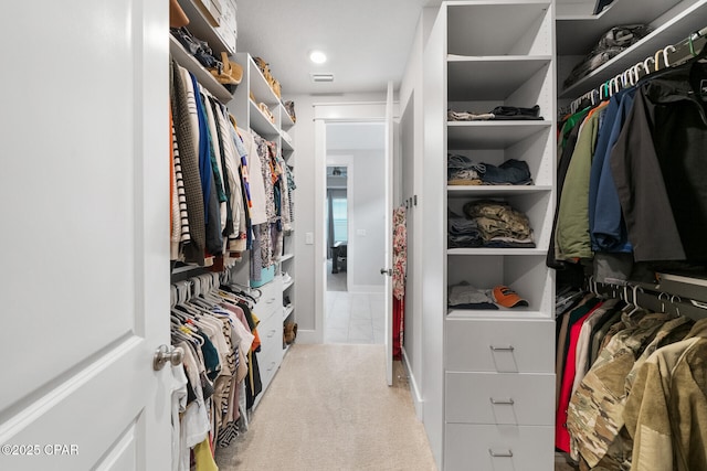 spacious closet with carpet flooring and visible vents