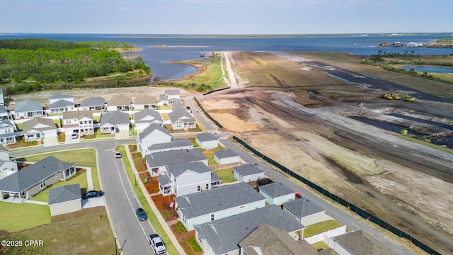 bird's eye view featuring a water view and a residential view