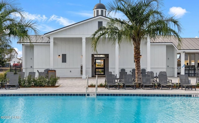 pool featuring a patio area and fence