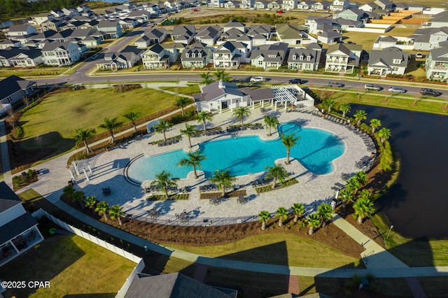 birds eye view of property featuring a water view and a residential view