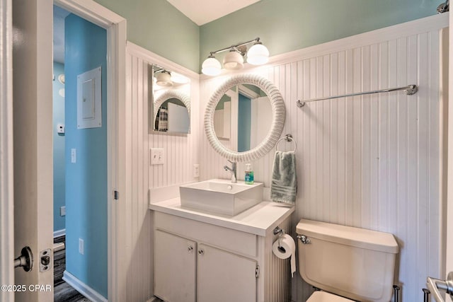 bathroom featuring vanity and toilet