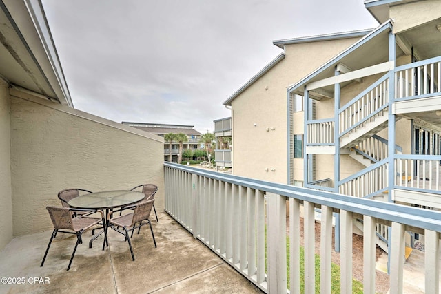 balcony featuring stairway