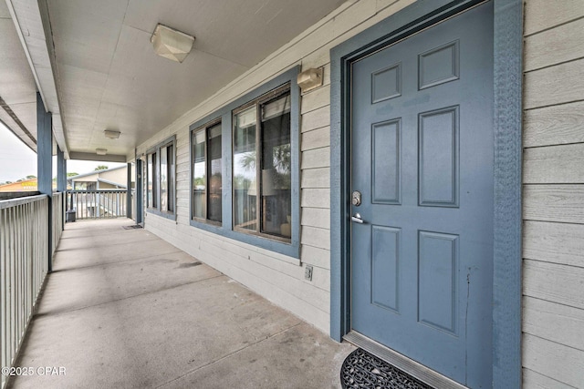 doorway to property with a porch