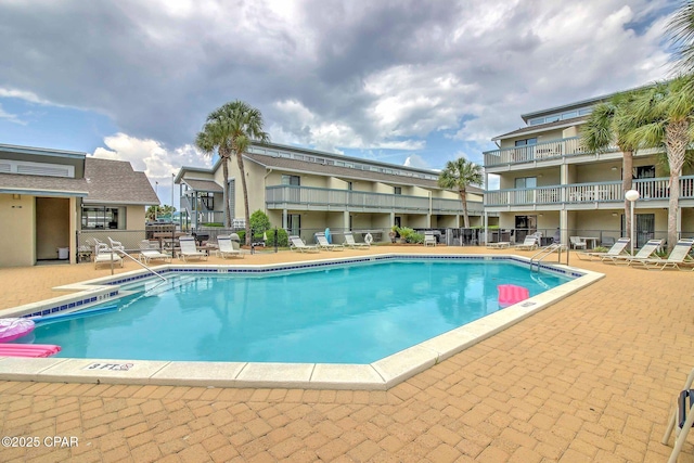 pool featuring a patio area