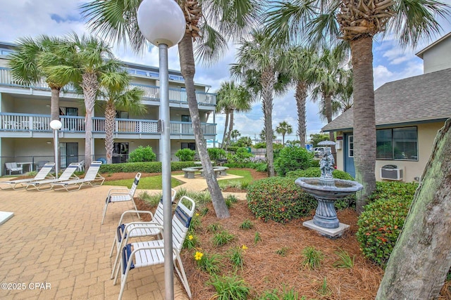 view of property's community featuring a patio area