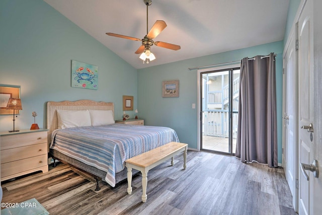 bedroom with a ceiling fan, vaulted ceiling, wood finished floors, access to outside, and baseboards