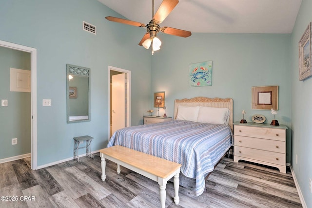 bedroom with visible vents, baseboards, lofted ceiling, ceiling fan, and wood finished floors