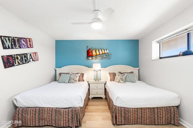 bedroom featuring ceiling fan and wood finished floors