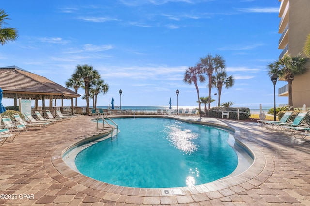 pool featuring a patio area, fence, and a gazebo