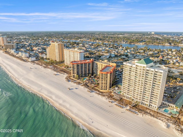 aerial view with a water view, a view of city, and a view of the beach