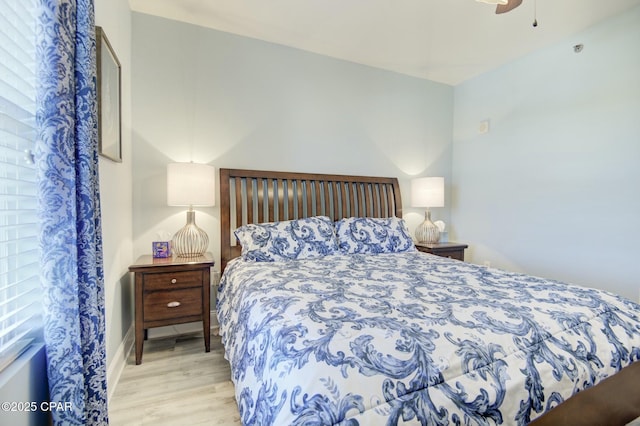 bedroom featuring a ceiling fan and wood finished floors