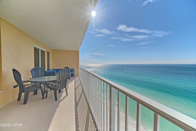 balcony featuring a water view