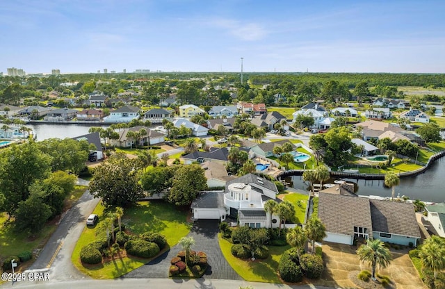 birds eye view of property with a water view and a residential view