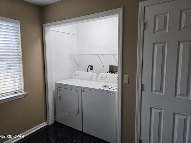 laundry room with washer and dryer, laundry area, and baseboards