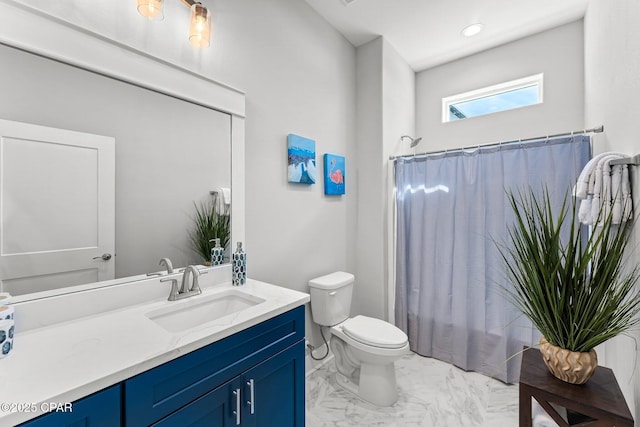 full bathroom featuring a shower with shower curtain, marble finish floor, toilet, and vanity