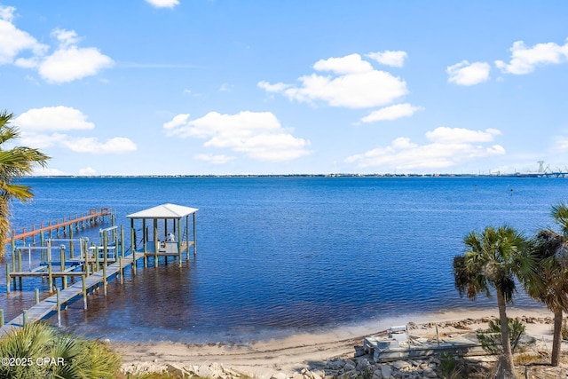 view of dock featuring boat lift and a water view