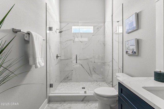 full bathroom featuring a marble finish shower, toilet, marble finish floor, and vanity