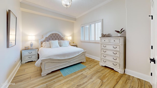 bedroom with light wood finished floors, baseboards, and ornamental molding