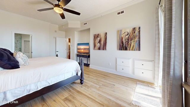 bedroom featuring baseboards, crown molding, visible vents, and wood finished floors