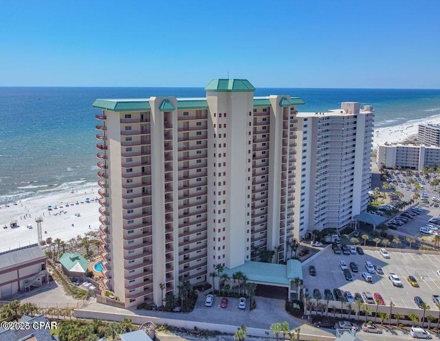 birds eye view of property with a view of city and a water view