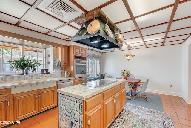 kitchen with plenty of natural light, a sink, oven, and black electric cooktop