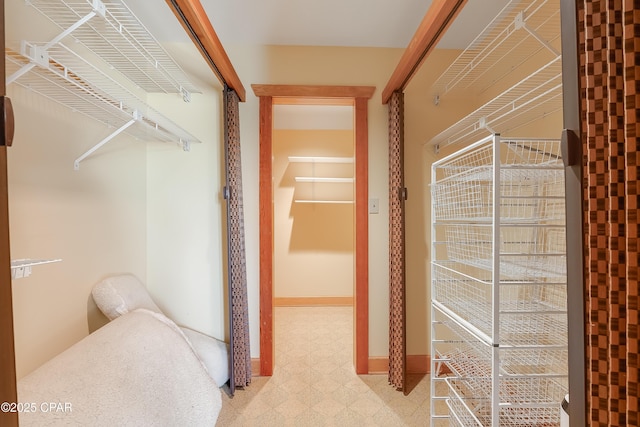 walk in closet featuring light floors