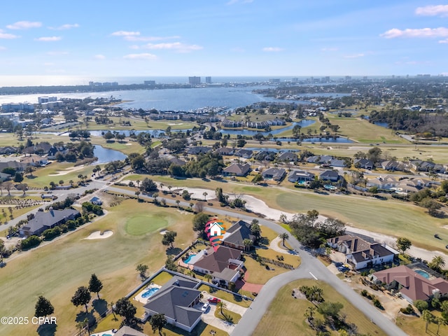 bird's eye view featuring a water view, a residential view, and golf course view