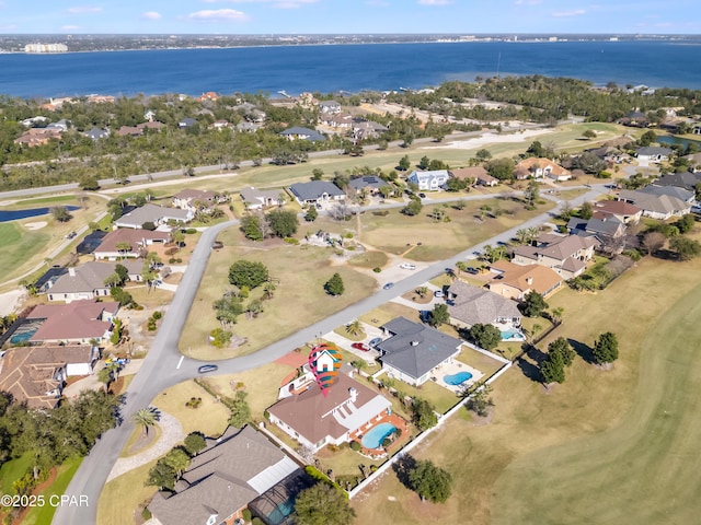 bird's eye view featuring a residential view and a water view