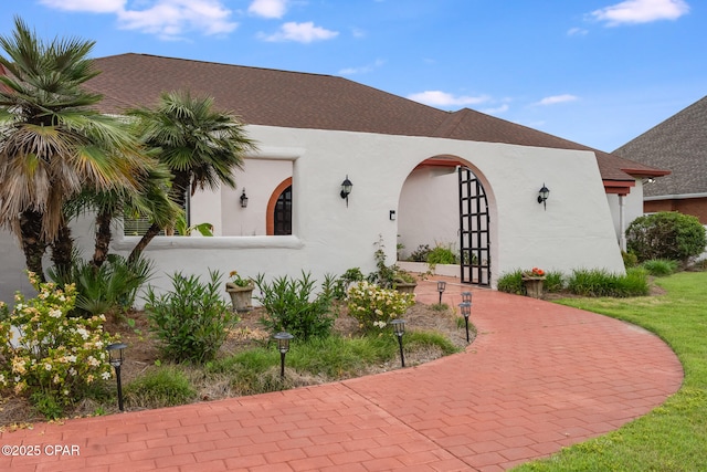 view of front of house featuring stucco siding