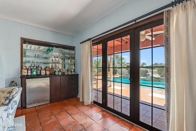 bar with a bar and high end refrigerator