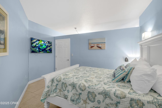 tiled bedroom with baseboards