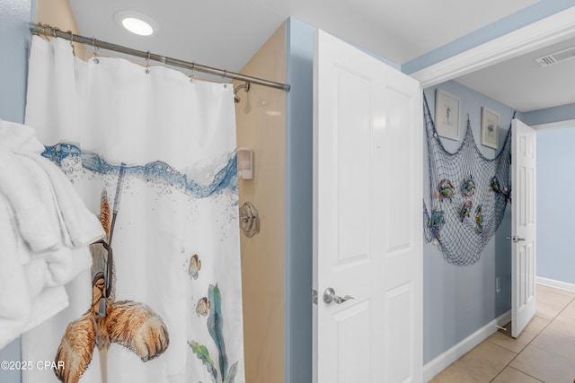 full bath with a shower with curtain, visible vents, baseboards, and tile patterned floors