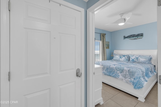 bedroom featuring tile patterned flooring and a ceiling fan