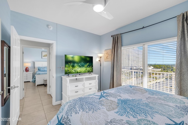 bedroom featuring ceiling fan and light tile patterned flooring