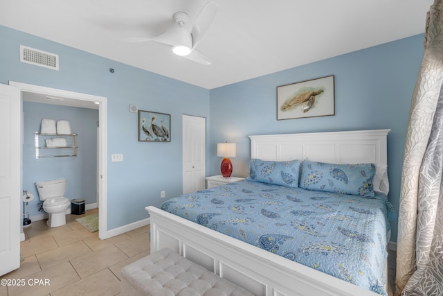 bedroom with light tile patterned floors, a closet, visible vents, ceiling fan, and baseboards