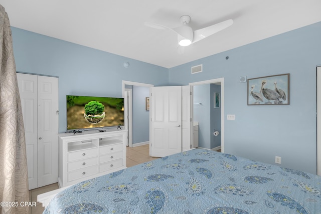 tiled bedroom featuring visible vents and ceiling fan