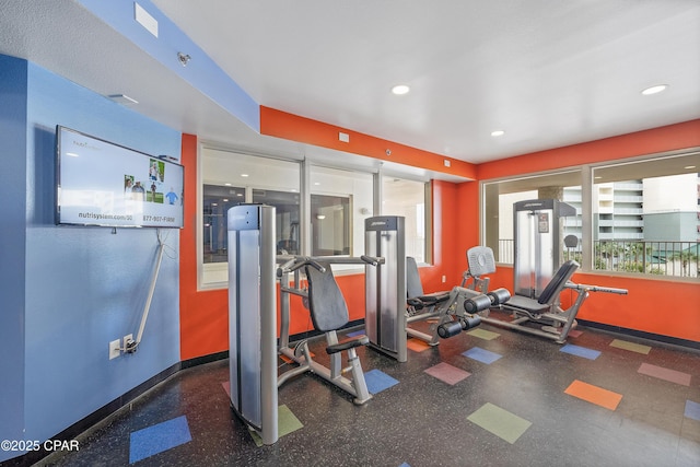 gym featuring recessed lighting and baseboards