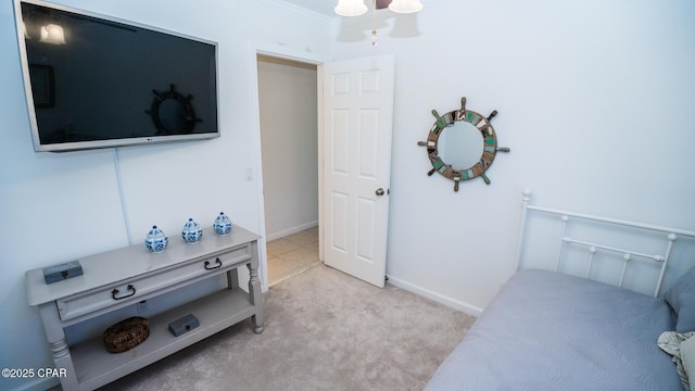 carpeted bedroom with baseboards and ornamental molding