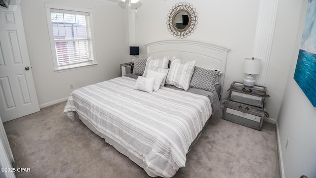 bedroom with carpet and baseboards